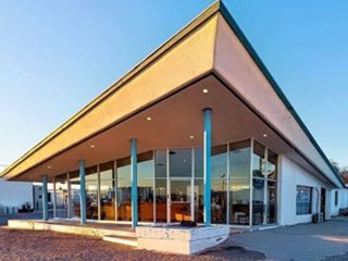 Googie Style Amboy Cafe glazed ground floor, triangular slanted roof of Cafe