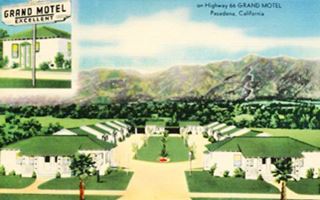 color linnen postcard 1940s. U-layout with green gable roof cabins around garden, two units hip roff face highway, mountains behind, Route 66 in front- Inset reads GRAND MOTEL EXCELLENT