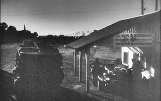 Daggett and the Grapes of Wrath A black and white still from The Grapes of Wrath, the Route 66 inspection station in Daggett and the Joads jalopy at night