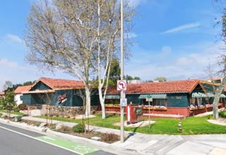 corner building, gable tiled roof, a restaurant, single floor
