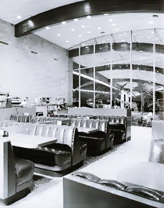 Henry’s interior dining area black and white: dining area, arched wood beams, glass, neat appearance c.1958