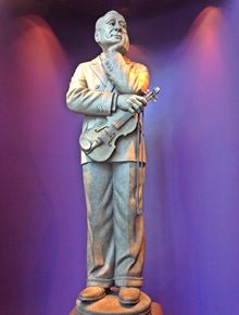 Jack Benny statue, Cucamonga Statue of a man holding a violin, in an alcove, Jack Benny