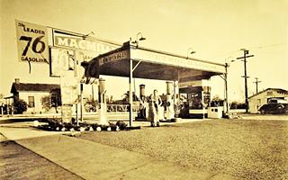 Jerry’s station c.1930s Monrovia sepia 1930s man and woman under flat canopy by pumps of a Union 76 gas station with tiny office behind