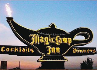 1950's Magic Lamp neon sign with flame, Cucamonga lantern-shaped neon sign MAGIC LAMP Restaurant, lit up at night with a flame from its spout