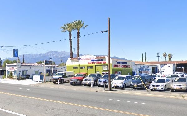 color 2023, auto dealer right, garage middle and motel left, US66 in front, mountains beyond