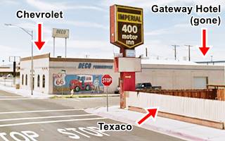 color view 2022, corner store, mural on wall, cross roads in Needles, motel to the right