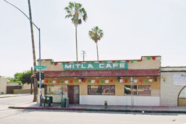 Mitla Cafe US66 San Bernardino single story cafe on a corner, MITLA CAFE written on its parapet, palm trees