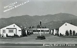 Monrovia Motor Lodge c.1950s Monrovia US66 1950s black and white photo motel with U-layout, gable roofed units, mountains behind