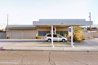 2 bays, 2 pump islands, flat canopy oblong box shaped gas station in Needles