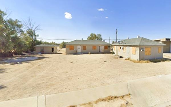 several hip roof units around a central yard, a former motel in Lenwood 2023