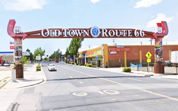 steel arch across an avenue with Route 66 shields and OLD TOWN ROUTE 66 written on it