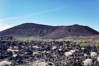 Pisgah Crater low black basaltic volcano in a lava field