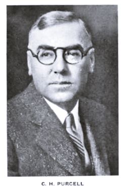 1932 photo of Charles H. Purcell man, with glasses in a black and white, 1932
portraite