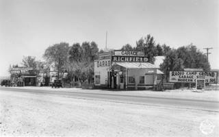 1935 Radio Camp, Lenwood by Burton Frasher black and white 1935, US66 in foreground, trees and buildings: garage, cafe, auto camp, filling station facing road