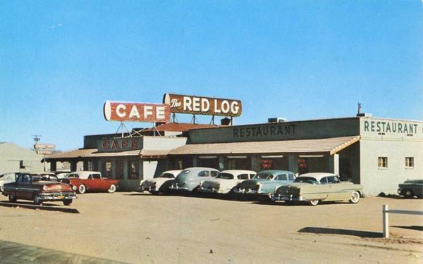 cafe, sign reads RED LOG CAFE, single story, gable roof, cars parked. c.1950s