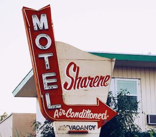 Sharene motel 1950s neon sign with red arrow and text SHARENE MOTEL AIR CONDITIONED VACANCY