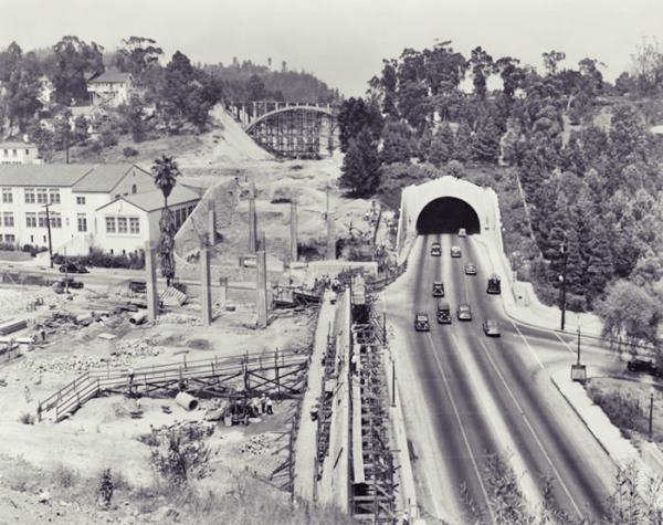 South Extension of Arroyo Seco in 1941, under construction. Los Angeles CA Route 66 black and white photo, 1941, looking north at ongoing works, on the left, columns of a viaduct and cut towards a bridge, on the right: the Figueroa St. Tunnel and roadway at Solano St.