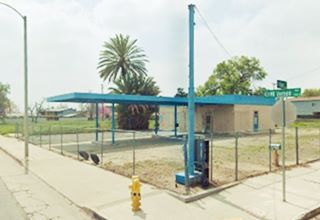 Tom and Jerry service station Route 66 San Bernardino vacant former gas station, long flat canopy over 2 pump islands, 2 service bays