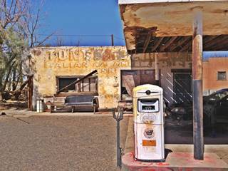 west wing of Whiting Bros. in Newberry Spring CA stucco wall with painted sign: Tony’cafe, canopy and white 1950s gas pump