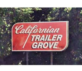 red sign white letters reads CALIFORNIAN TRAILER GROVE and 222 in black