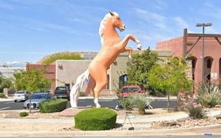 24 foot tall Golden Palomino statue, standing on its hind legs by a Shopping mall