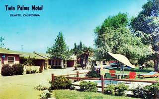 Twin Palms motel Duarte CA color postcard 1950s, motel units left, trees, lawn and parasol to the right, sunny day