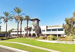 Virginia Dare Winery Business Center, 2024, US66 Cucamonga building with tower and Spanish tiled roofs, palm trees and lawn, color