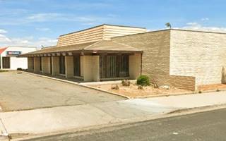 vacant corner building, brick walls, one story