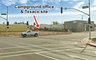 color view of a crossroads, parking areas, warehouses, traffic lights, vehicle