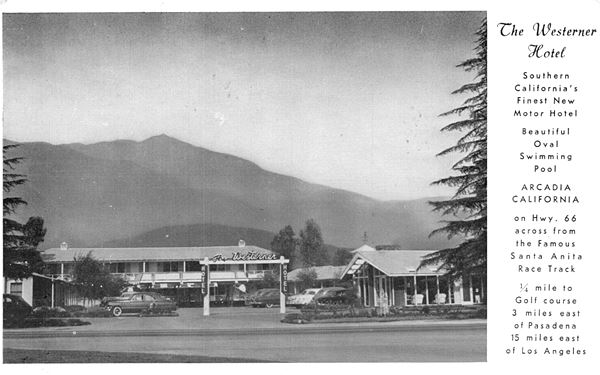 1950s Westerner hotel postcard Arcadia CA Route 66 black and white 1950s photo oostcard: motel bldgs. around courtyard, cars parked mountains beyond, text on the side says The Westerner Hotel