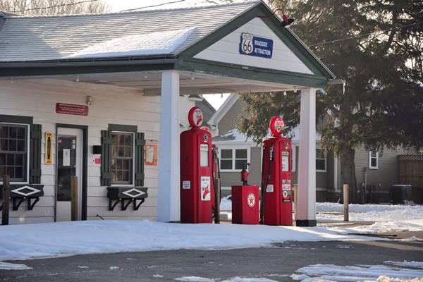 canopy, pumps and office of old Texaco station under the snow