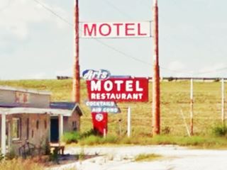 vintage Art’ motel 1950s neon sign and above the a modern one with white squares with red letters spelling MOTEL