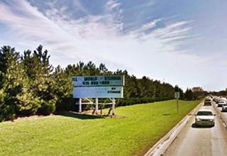 former drive in theater marquee on grassy area by old ALT 66 highway
