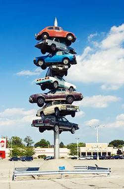 Spindle Sculpture Berwyn Spindle with 8 real cars impaled on it