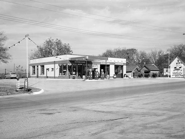 Woody Blair Skelly gas, 1951, US66 Lexington black and white 1951 Cafe and adjoining icebox shaped Skelly station with flat canopy, 3 pumps, 2 service bays and glass corner office