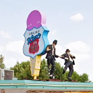 Blues Brothers statues dancing in Joliet Blues Bros. statues dancing on the rooftop by a giant ice cream cone