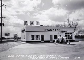 Brodner Standard Station and Lexington Cafe Black and white, 1951, block shaped Standard station, corner cafe, EAT sign atop roof, single bay right, 2 pumps, central office