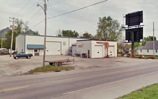Bruce welding shop sheds on a street corner, a welding shop