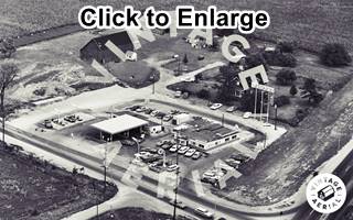 aerial view a Texaco and Diner in 1968, US66 Dwight Il Black and white, 1968 aerial view a crossroads of US66 and IL-47, a Texaco station, cars and a restaurant