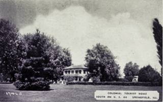 Colonial Tourist Home black and white, 2 story hip rof building in a park, a lodge c.1930s