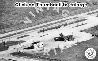 black and white thumbnail of aerial view 1981 with an Amoco station and a restaurant at a crossroads Crossroad Restaurant aerial picture Mt.Olive US66