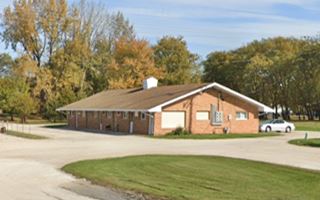 long gable roof, single story building with drive