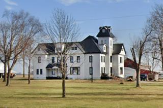 Thomas mansion Route 66 two story mid 1800s gable roof mansion, painted white in a park