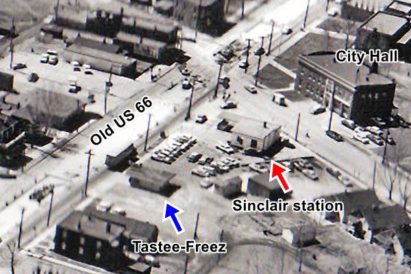 black and white aerial photo from 1960, shows the city hall, buildings and Broadway with the Tastee-Freez and Sinclair filling station