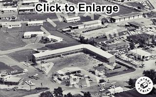 aerial view of Fiesta Motel, Cafe and D-X filling station, 1968 Black and white, 1968, aerial view L-shaped motel, cafe, gas stations