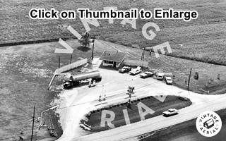 1967 aerial photo Gas for Less Benld IL black and white aerial photo of gas station and truck next to a highway