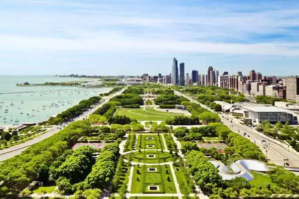 park seen from the air, trees, lawn, lake Michigan (left), skyscrapers