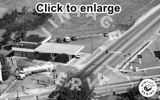 aerial view former Halls Texaco in 1988 Black and white, 1988 aerial view Mobil gas station, gas truck, cars and road intersection
