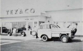 Hall’s second Texaco 1965 Black and white, 1965 Texaco station, tow truck by it, office with large glass panes