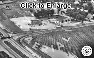 Hen House on US 66, 1974 Black and white, 1974, junction of highways, restaurant on the corner, gas station and motel to the right